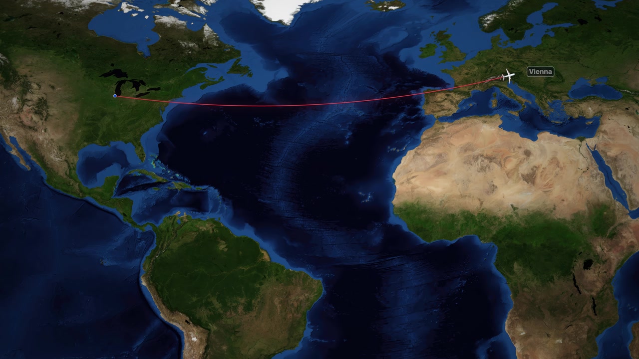 Animation of a red line tracking an airplane flight from Chicago to Vienna.