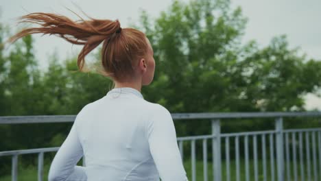 redhead woman running outdoors