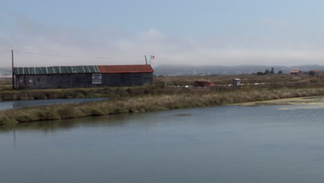 warehouse of salt pans built in wood, with the saltwater pond