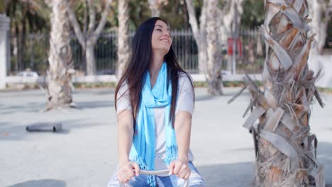 pretty vivacious woman in an urban park