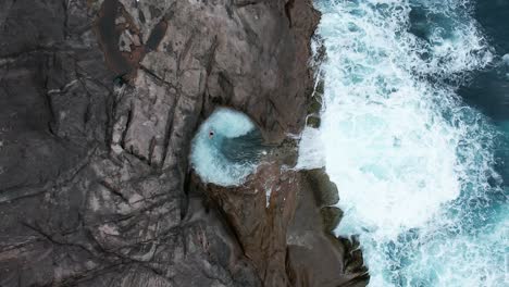 a man swims in a rock pool