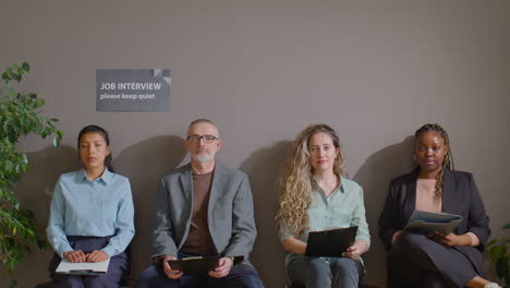 group portrait of job candidates waiting for interview