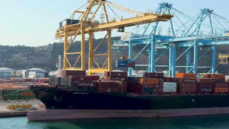 barcelona port, containers ship, crane loading containers on ship