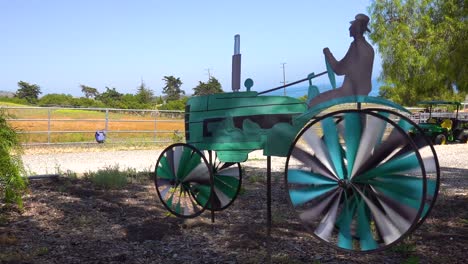 a tractor yard ornament with wheels spinning at a ranch or farm in santa barbara california