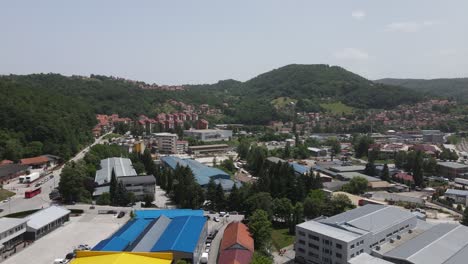 Aerial-View-of-Krcagovo,-Industrial-Suburbs-of-Uzice,-Serbia-on-Sunny-Summer-Day,-Drone-Shot