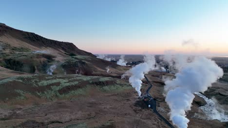 steaming fumaroles emitting sulfuric gas in hverir, iceland