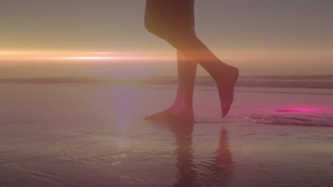 animation of light spots over caucasian woman at beach