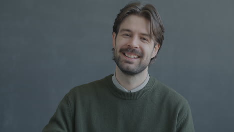 smiling man showing okay sign