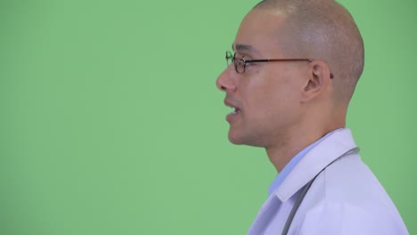 happy handsome bald multi ethnic man doctor