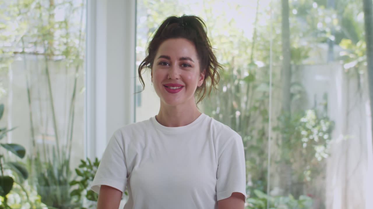 Sportswoman Smiling at Camera during Body Twisting Exercise