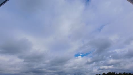 time lapse of clouds quickly rolling in the sky