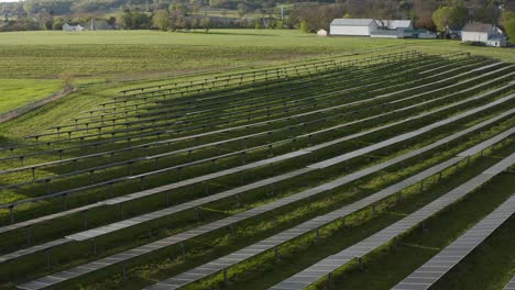 Aerial-tilt-up-reveals-solar-panels-on-cloudy-day