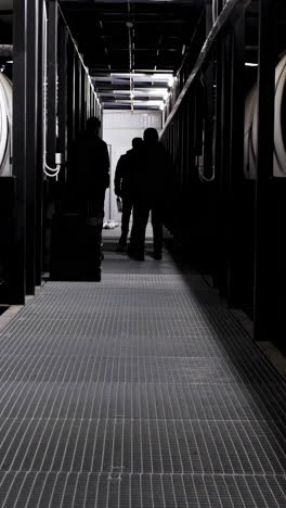 industrial facility workers in a corridor