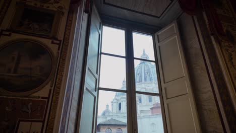 panoramic shot of st. peter’s basilica from inside the vatican museums