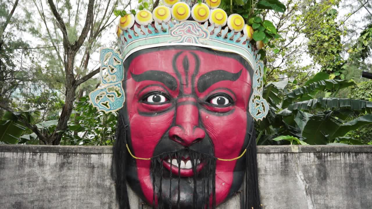 Giant Red Mask on a Wall