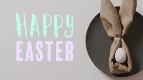 animation of happy easter text over easter eggs in cloth on white background