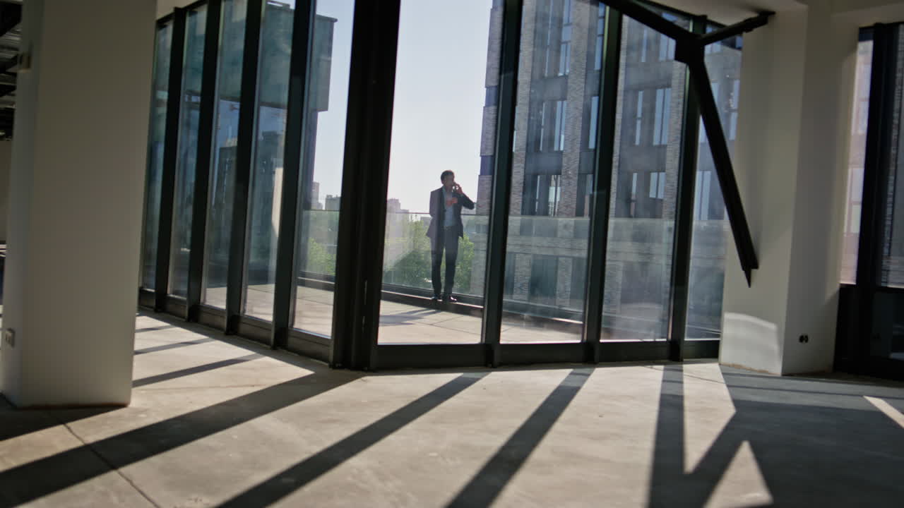 Businessman silhouette calling cellphone standing terrace. Director talking