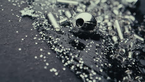close-up of black resin with silver glitter and beads