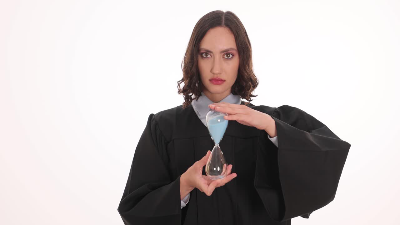 Woman Judge in Academic Gown Holding Hourglass