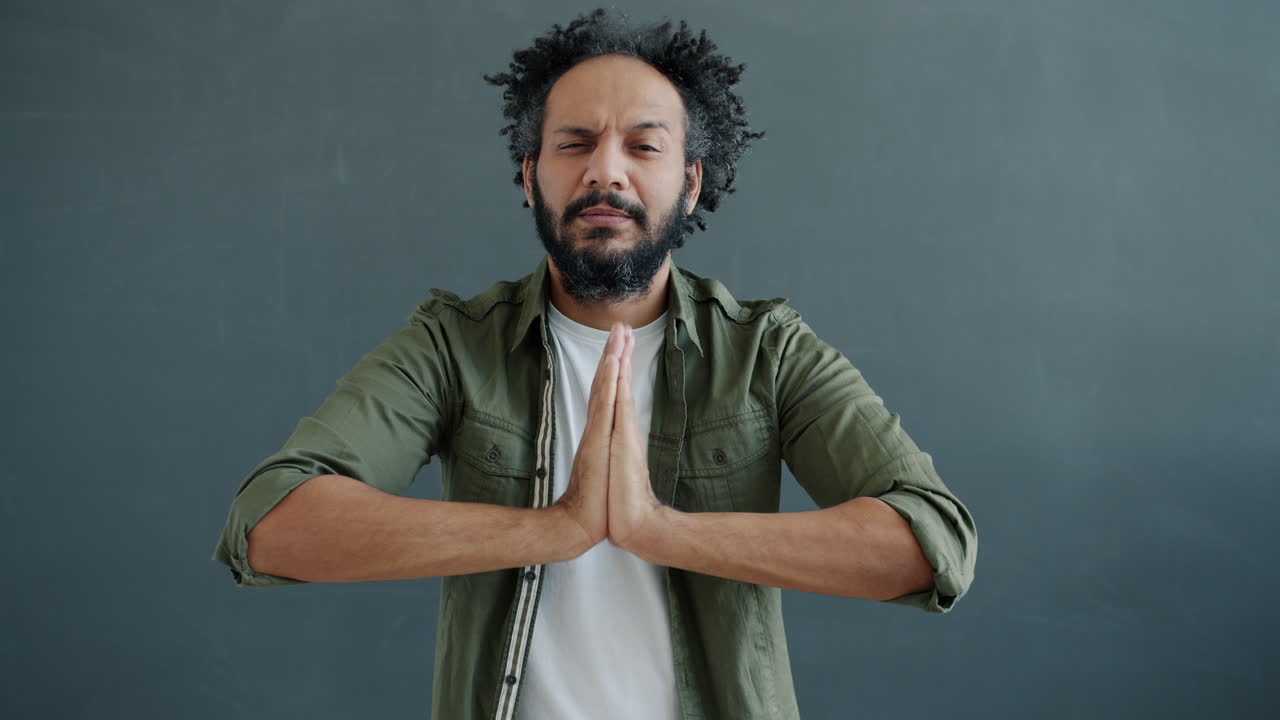 Man in prayerful meditation pose