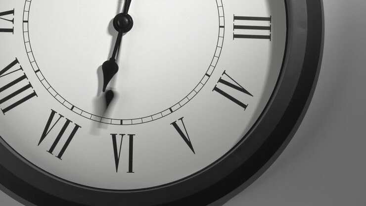 Latin Clock Face in Time Lapse on White Wall