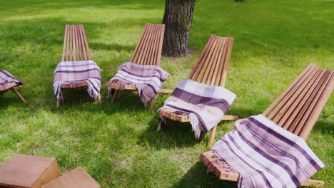 Several-Wooden-Sun-Beds-With-Rugs-On-A-Green-Lawn-A-Place-To-Relax-At-The-Resort-Hd-Video