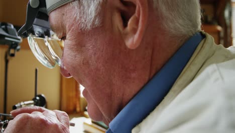 horologist using a machine