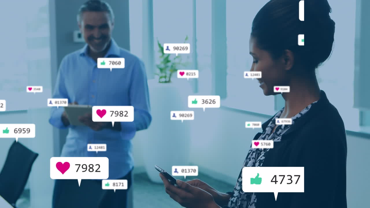 Animation of media icons over diverse business people in office