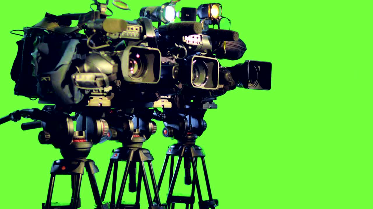 Broadcasting professional camcoders on a green screen.