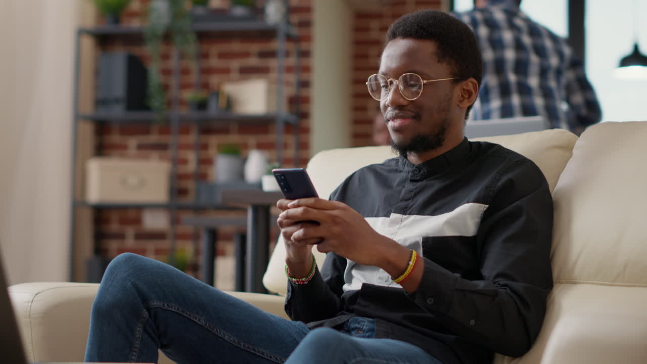 African american man browsing internet on smartphone