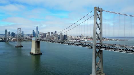 drone flies calmly over oakland bay bridge in san francisco (60fps)
