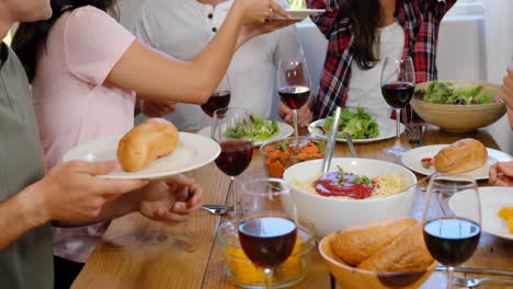 happy friends having healthy lunch with wine