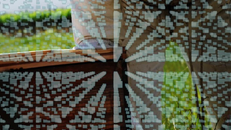 Person sitting on bench with digital data animation overlaying scene
