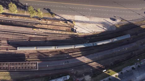 aerial top down of trains running on tracks close to chacarita station