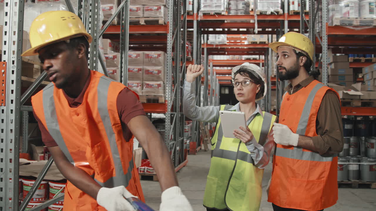 People in Uniform Working in Warehouse