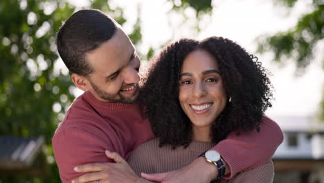 love, nature and couple hugging in a garden