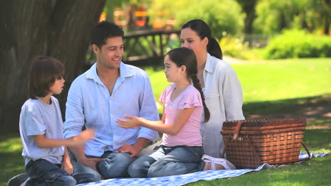 parents on a picnic with their children