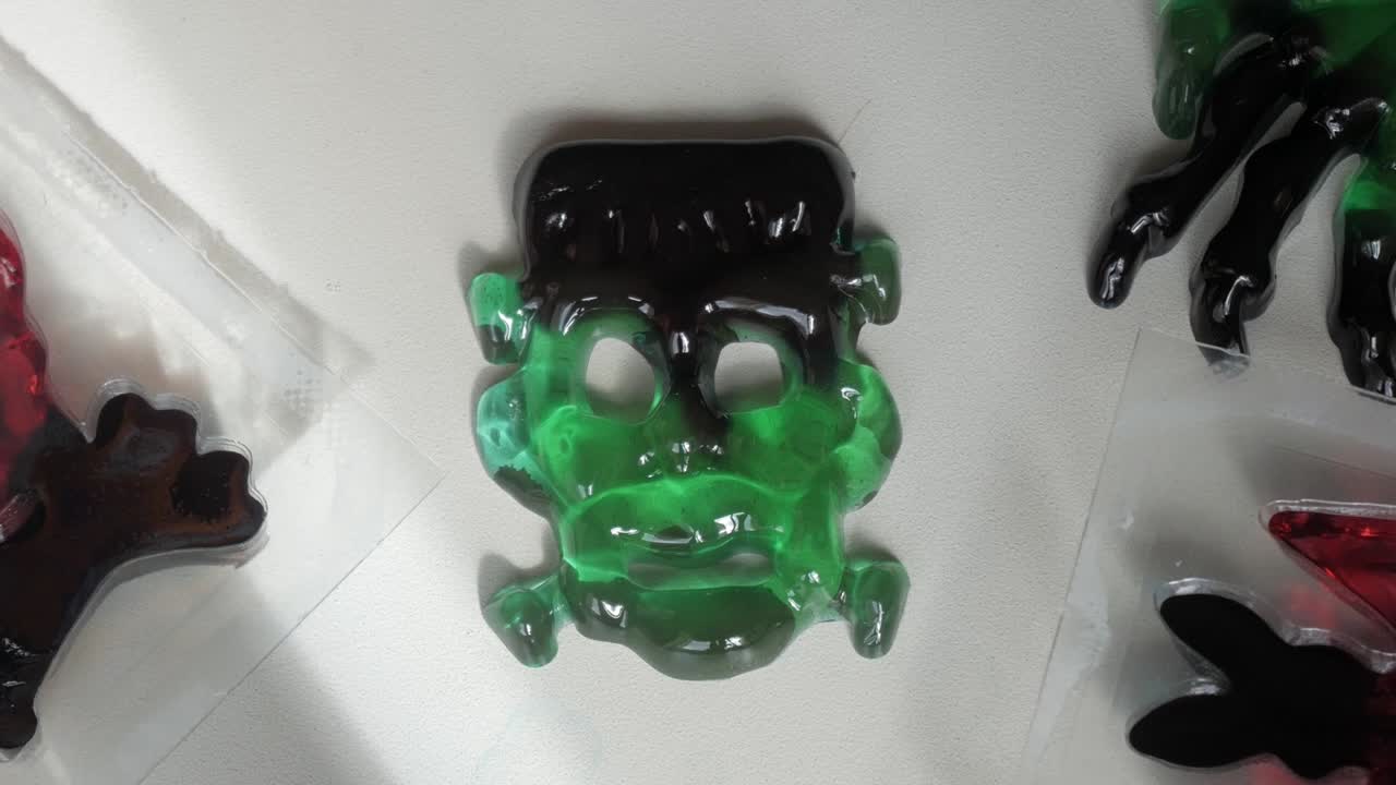 Green and black Halloween jelly shaped like a classic monster face