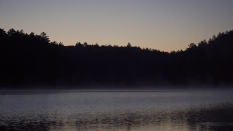 steam rising on beautiful lake at sunrise, algonquin park