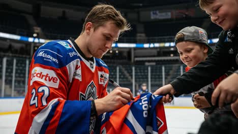 a hockey player interacting with excited fans as he signs memorabilia, showcasing the joy of sportsmanship and community engagement in a vibrant arena