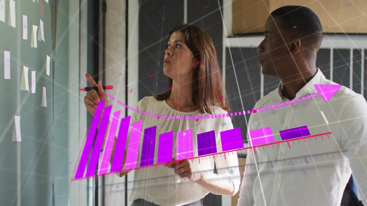 Woman pointing with pink marker starting magenta chart filling, peer watching and explaining trends