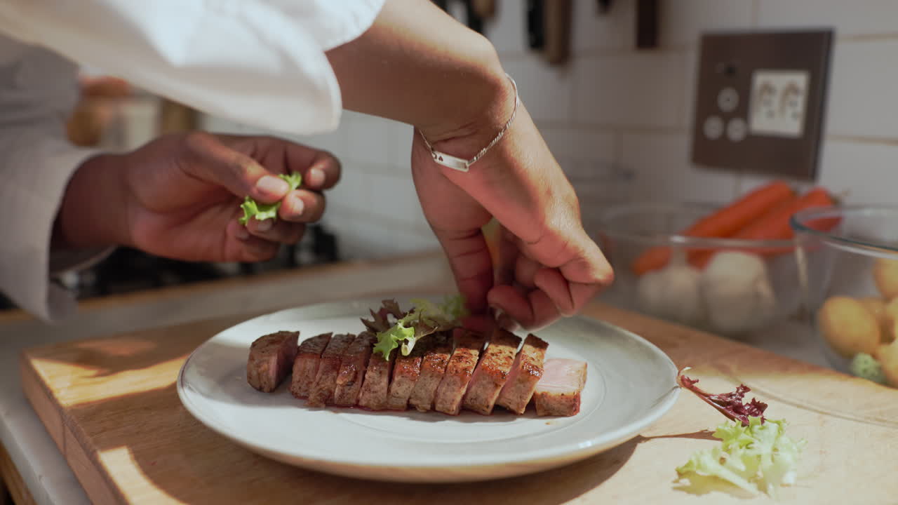 Chef Plating Sliced Meat with Salad