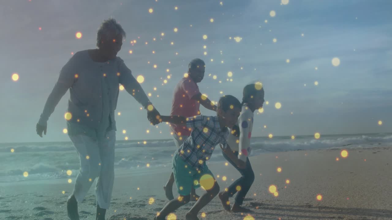 Grandfather leaning forward triggers family jogging along beach with sparkles for travel marketing