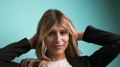 happy transgender businesswoman playing with hair and puckering lips