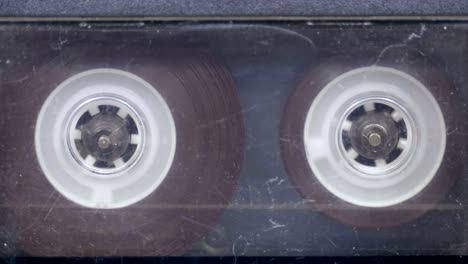 the vintage audio cassette in the tape recorder rotates