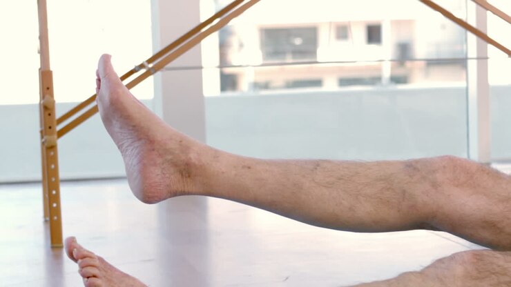 Old man stretching his leg