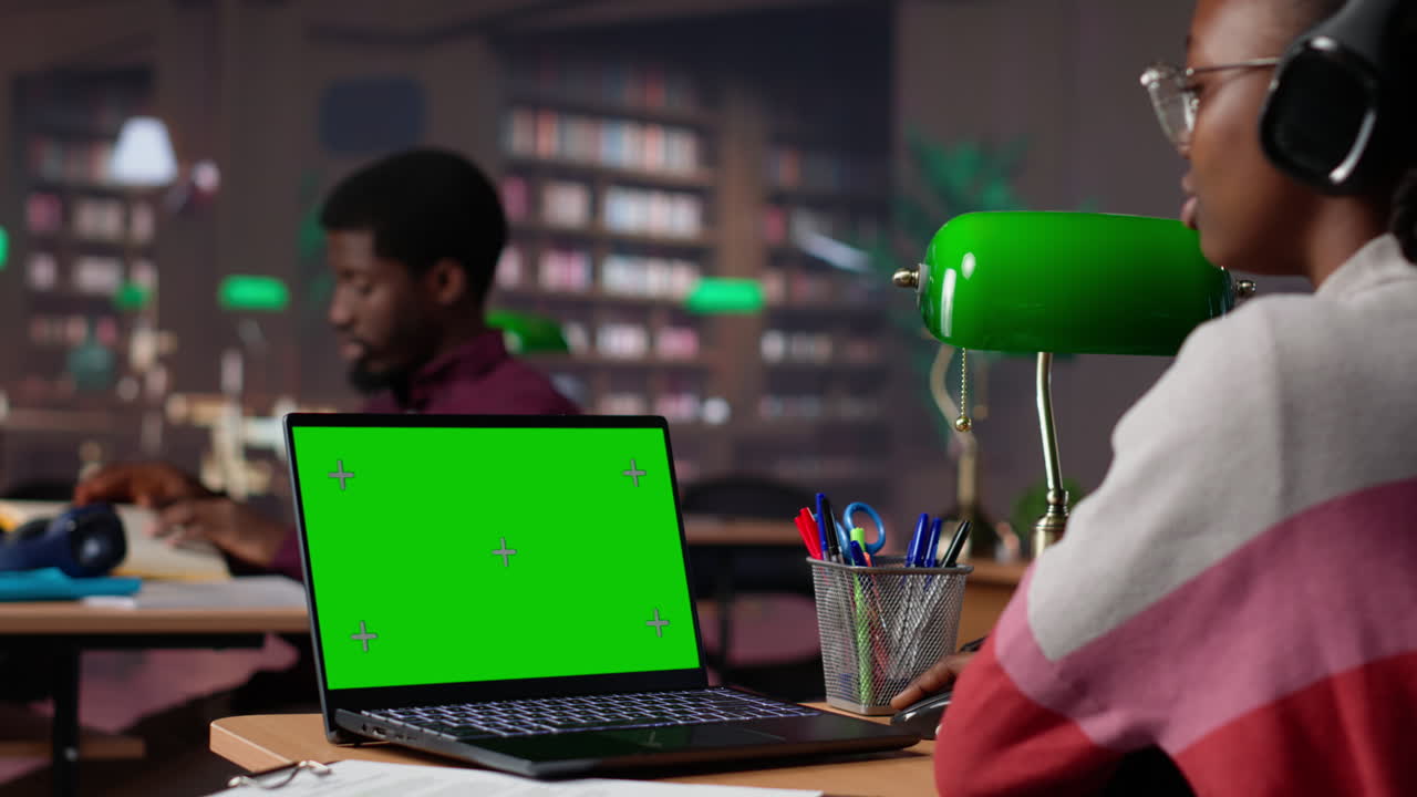 Young student uses mockup display while doing research for exam preparations
