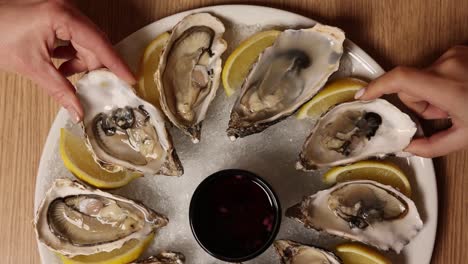 oysters with lemon and sauce