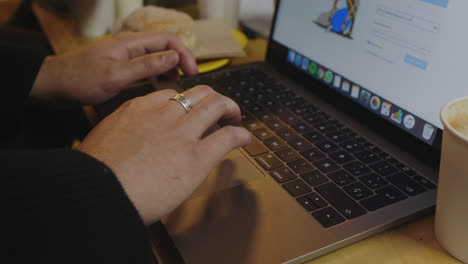 Businessman-hands-browsing-internet-on-laptop.-Freelancer-working-on-laptop