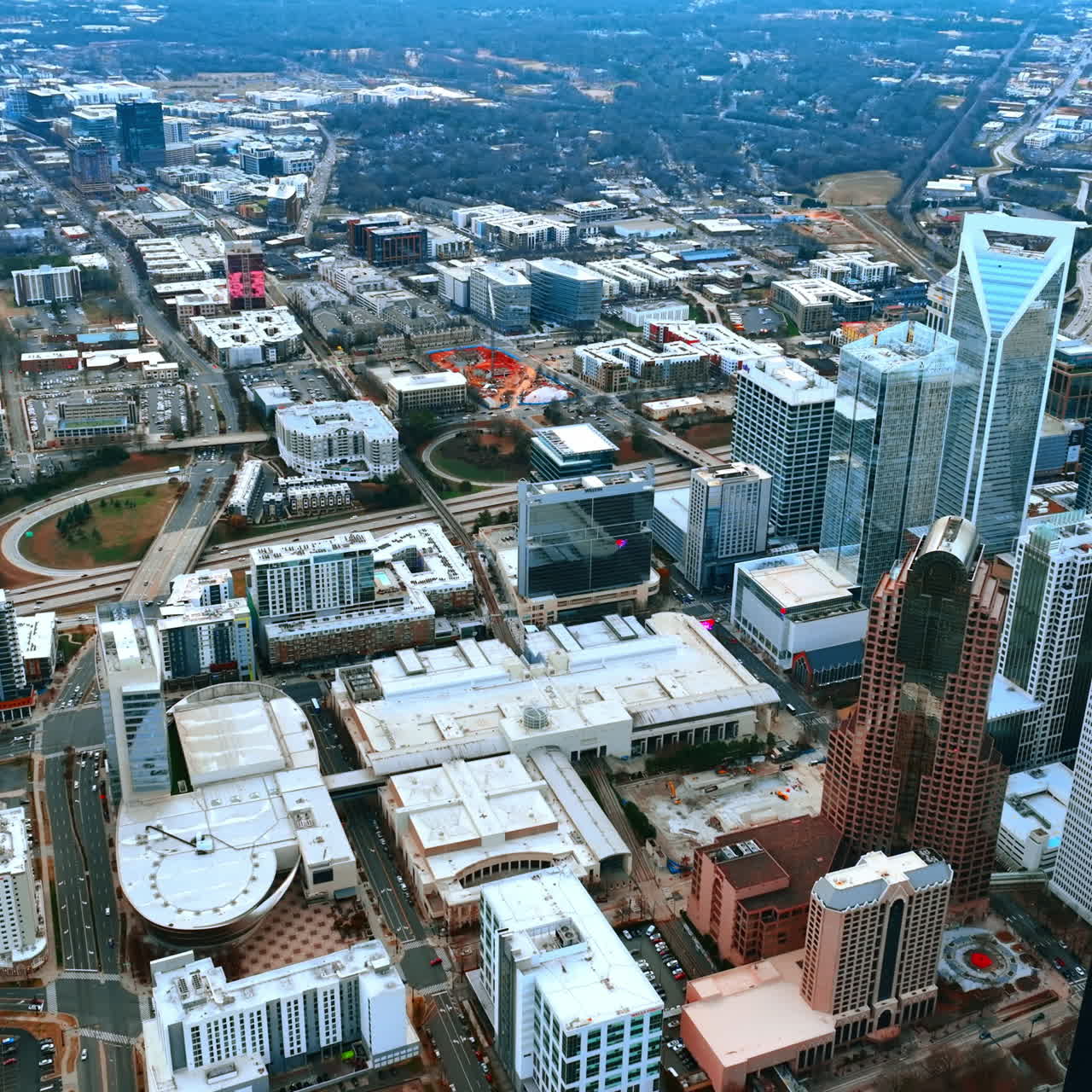 Dense urban landscape of the modern American city. Drone footage above Charlotte, North Carolina, USA.